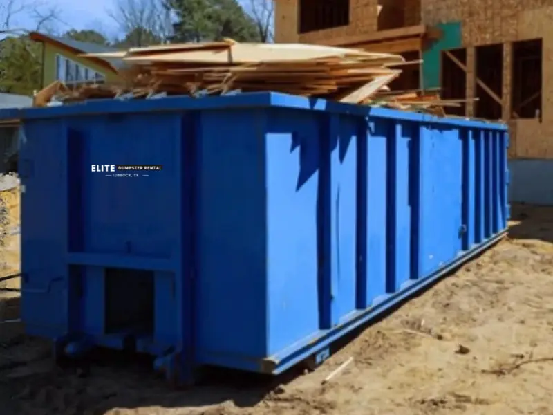 Construction dumpster rental in Lubbock, TX with a roll-off container at a job site