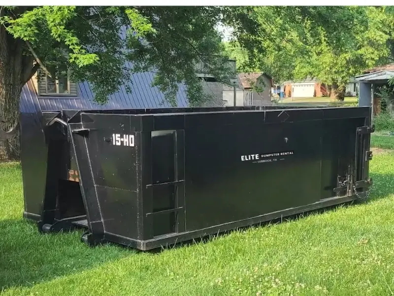 Roll-off dumpster for yard waste & landscaping dumpster rental Lubbock, TX waiting to be loaded with branches and brush